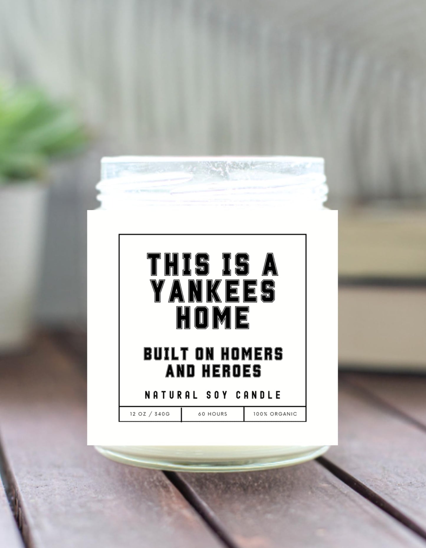 This is a Yankees Home - Built on Homers and Heroes Candle - Scented Soy Wax Candle (8.0 oz) 50-60 Hour Burn Time, Cotton Wick, Frosted White Glass Jar