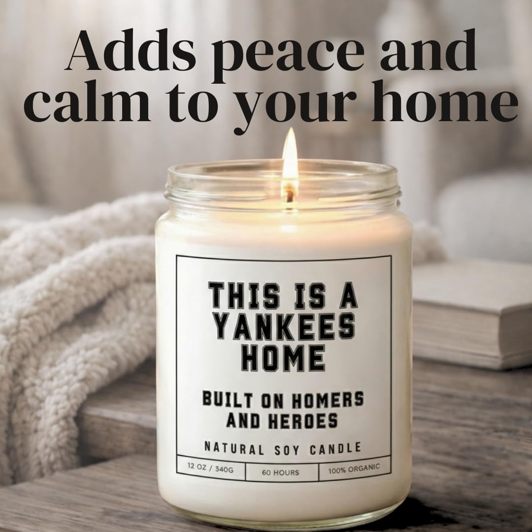 This is a Yankees Home - Built on Homers and Heroes Candle - Scented Soy Wax Candle (8.0 oz) 50-60 Hour Burn Time, Cotton Wick, Frosted White Glass Jar