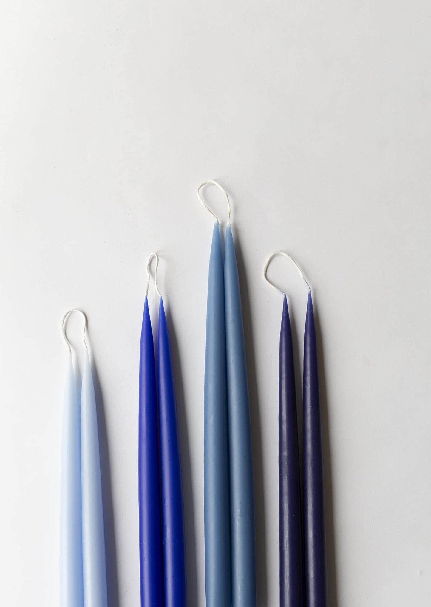 Kunstindustrien® Taper Candles – Set of 4, 13.8" – Made in Denmark, Long Burning Candles 15h, Unscented & Smokeless Candlesticks – Elegant Tall Candles for Weddings, Dinners & Home Decor (Pastel Blue)