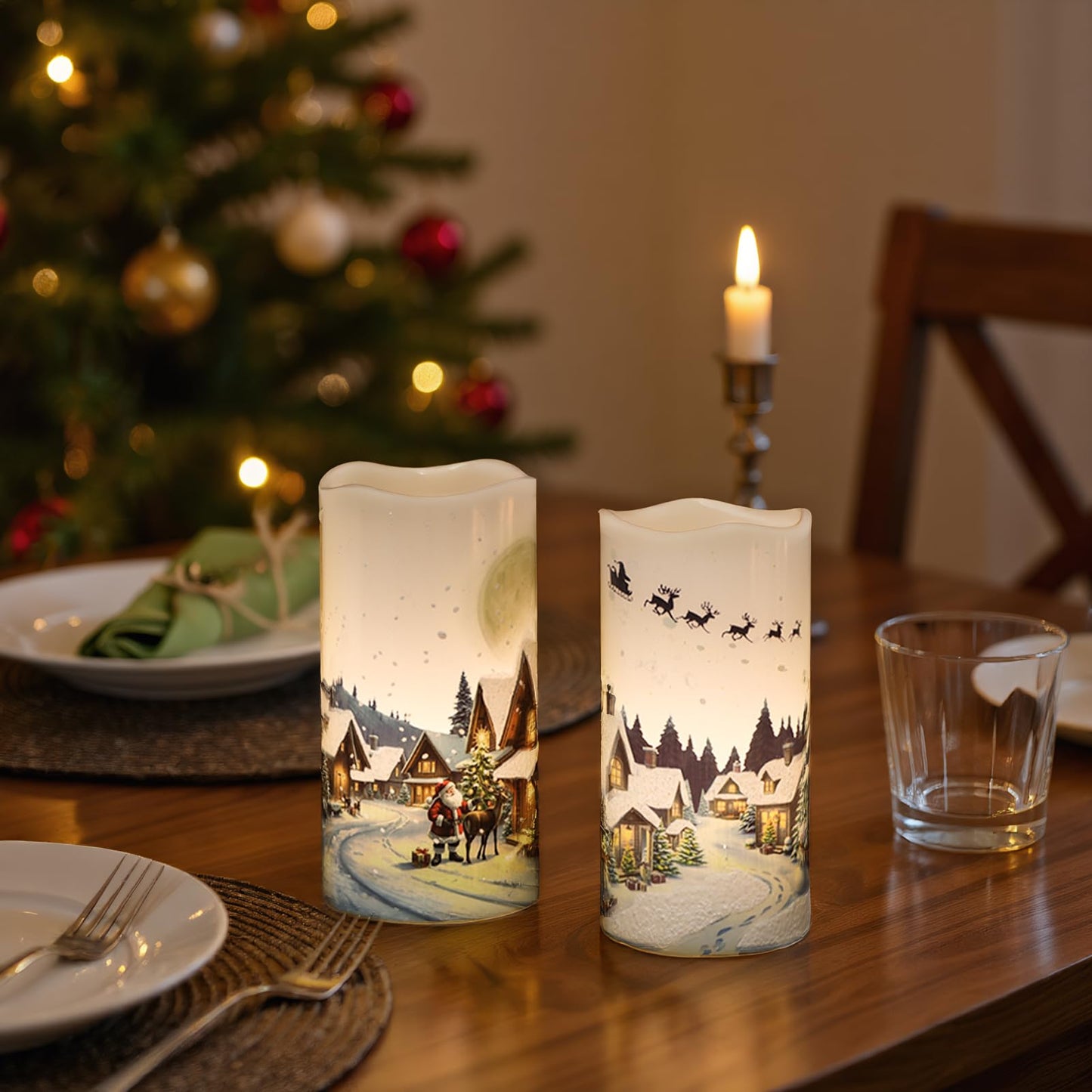 KunSwenn Christmas Flameless Candles, Christmas LED Battery Operated Candles with Remote Timer, Set of 2 Pillar Candle with Snow House, Santa, Reindeer Decals for Holiday Winter Decor(D6” x H3”)