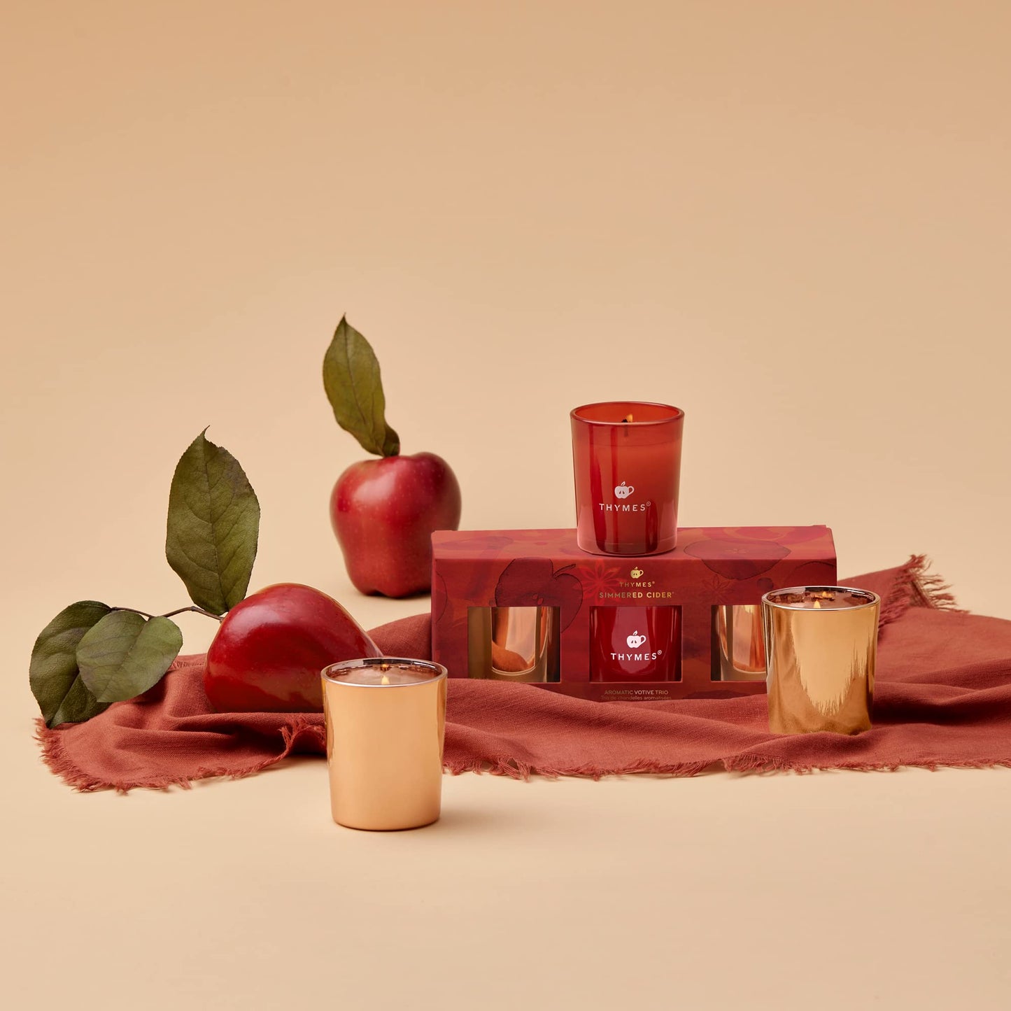 Thymes Aromatic Votive Trio – Set of Three Votive Candles – Luxury Home Fragrance – Scented Candles with Notes of Freshly Pressed Apple, Clove, & Cardamom – Red & Rose Gold (Simmered Cider, 2 oz Each)