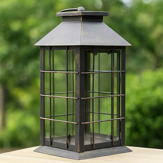 Seraphic 11" Rustic Decorative Candle Lantern – Vintage Metal & Glass Holder for Pillar Candles – Farmhouse Tabletop & Hanging Lantern for Indoor or Patio Decor, Bronze Brushed