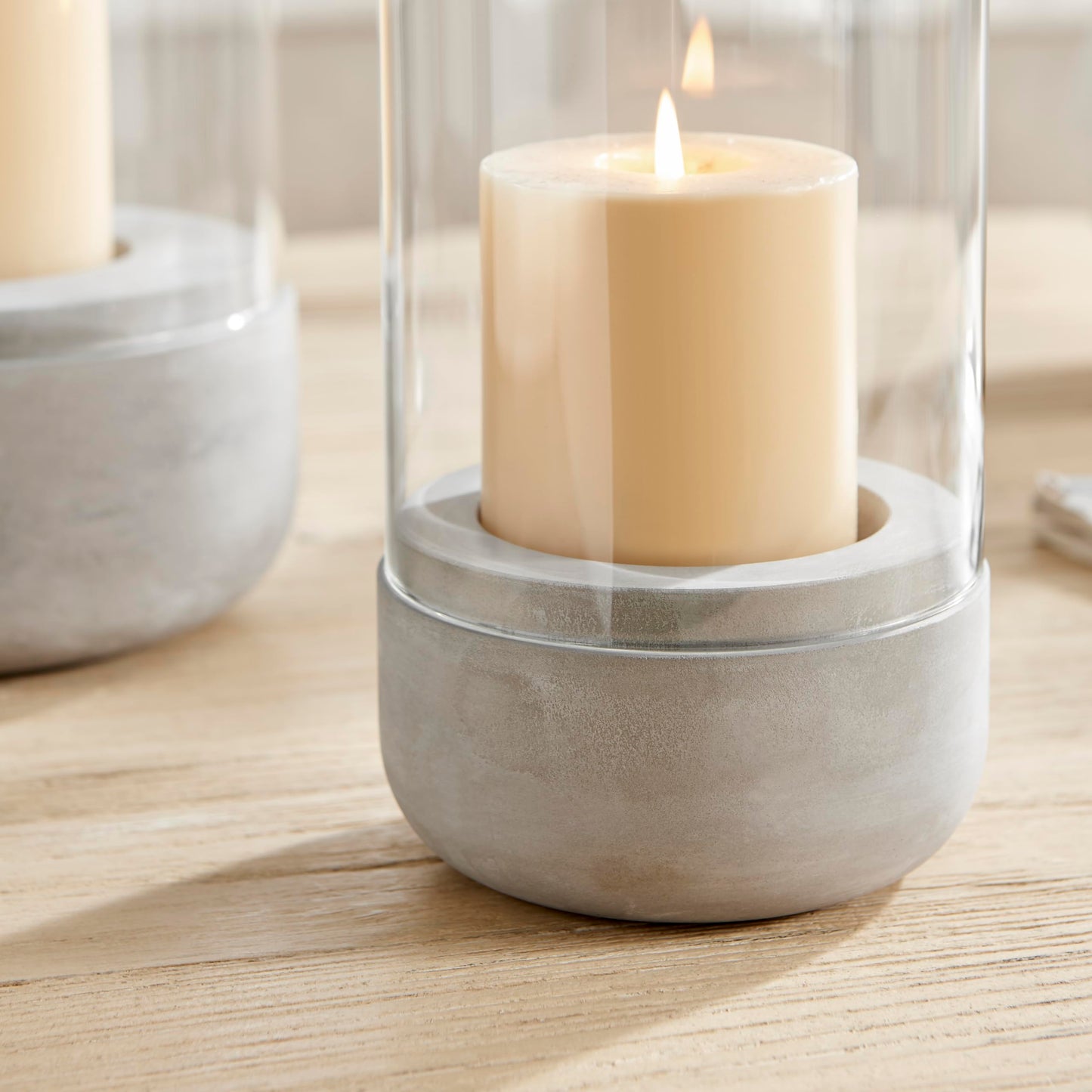 Danya B. Modern Cool Gray Cement Base and Glass Pillar Hurricane Candle Holder (Small)
