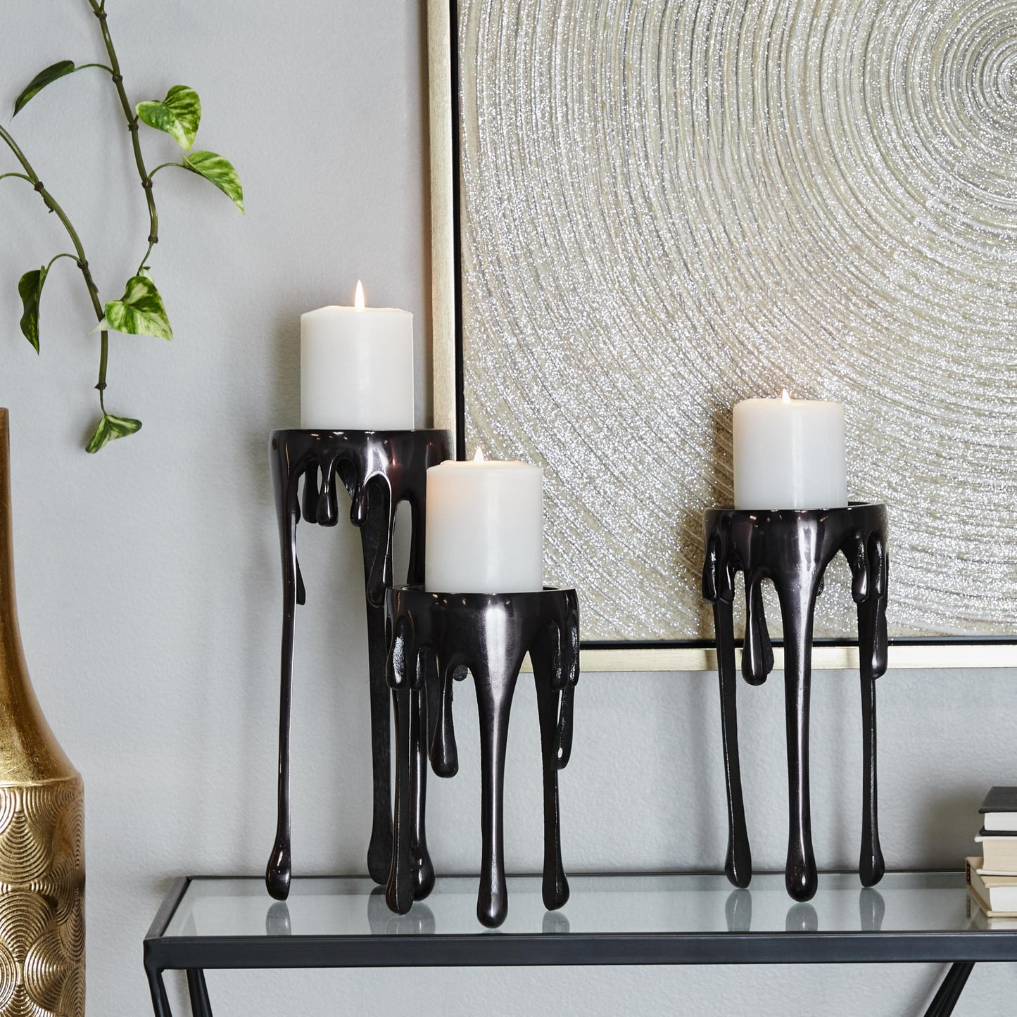 CosmoLiving by Cosmopolitan Aluminum Metal Decorative Candle Holder Pillar Candle Stand with Dripping Melting Designed Legs, Set of 3 Candlestick Holder 12", 10", 8"H, Black